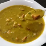 Creamy pea soup with bacon and pepperoni